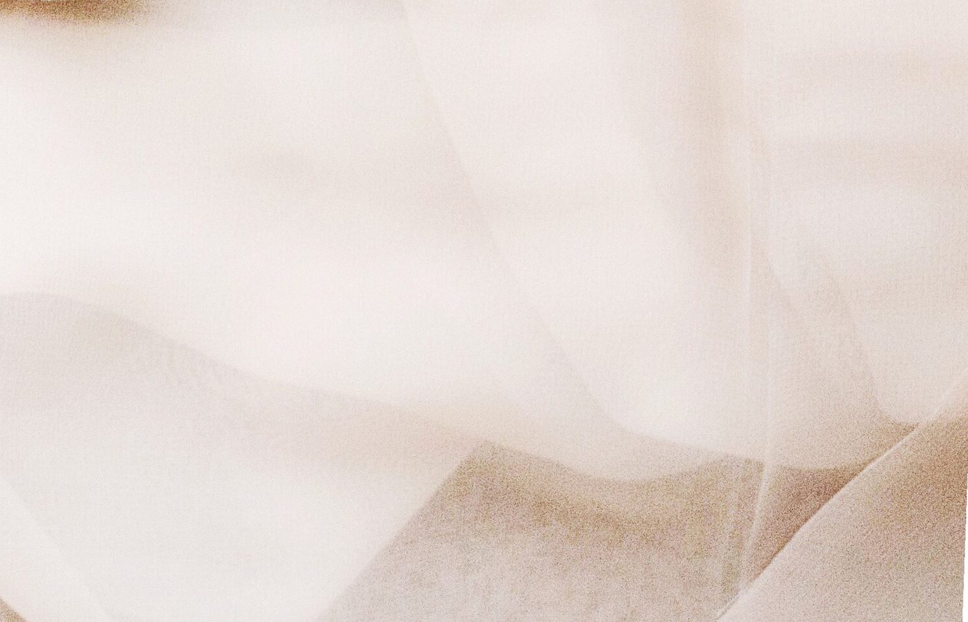 Pale pink chiffon fabric under soft diffuse light